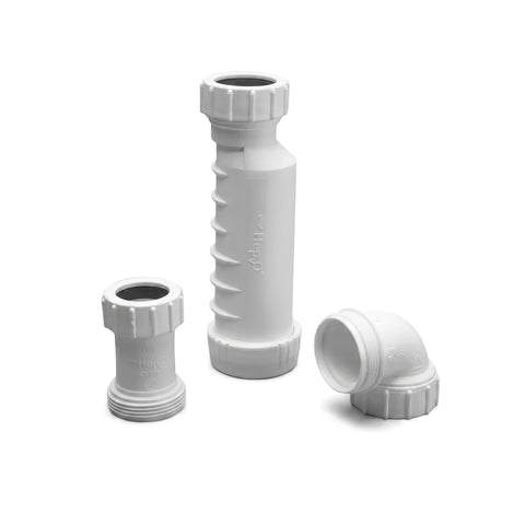 A close-up shot of three white plastic shower channel waterless kit shower parts, including two cylindrical extensions and