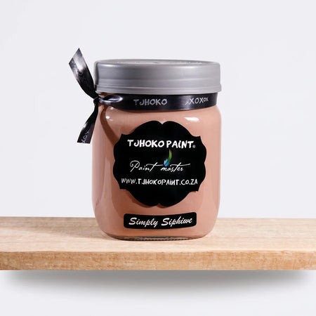 Simply Siphiwe 500ml Tjohoko chalk paint in a glass jar with a black label and ribbon, featuring a light brown/nude hue.