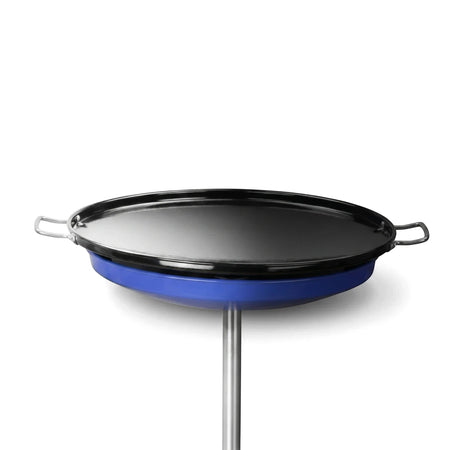 Black Skottel Braai, a round griddle with two silver handles and a blue base, on a silver stand.