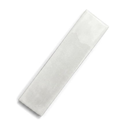 Snowflake Subway Tile - 75x300mm, a white glossy rectangular tile, displayed diagonally.