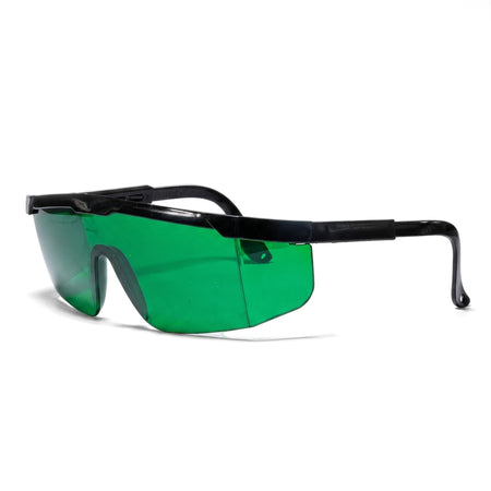 Green safety glasses with a black frame, featuring broad wraparound lenses for protection, viewed from a side angle.
