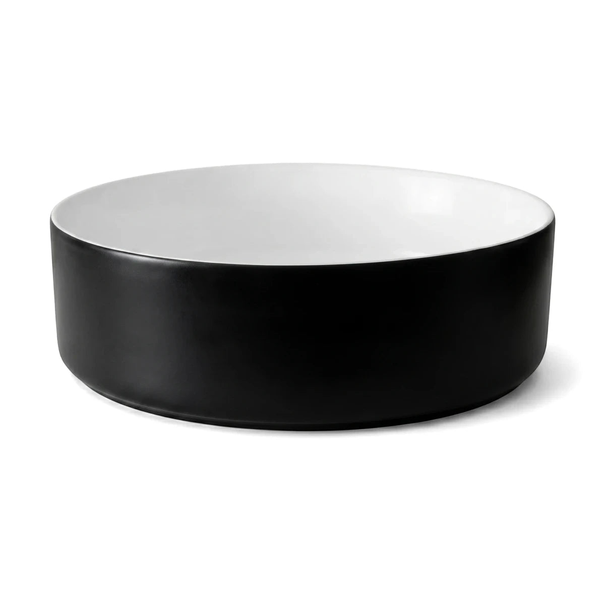 Starling Freestanding Basin with a sleek black exterior and clean white interior, presented in a round, modern design.