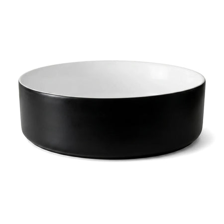 Starling Freestanding Basin with a sleek black exterior and clean white interior, presented in a round, modern design.