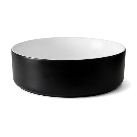 Starling Freestanding Basin with a sleek black exterior and clean white interior, presented in a round, modern design.