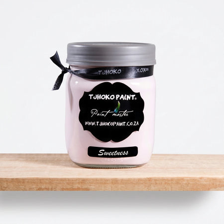 Sweetness 500ml chalk paint in a clear glass jar with a black label, grey lid, and black ribbon, displayed on a wooden shelf.