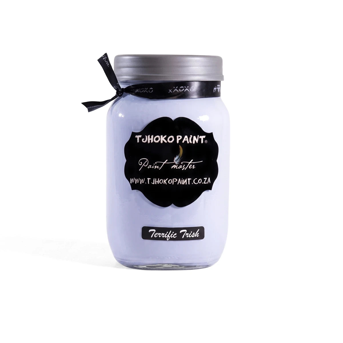 Terrific Trish 1L chalk paint jar in light lavender, with a black label, silver lid, and black ribbon on a wooden shelf.