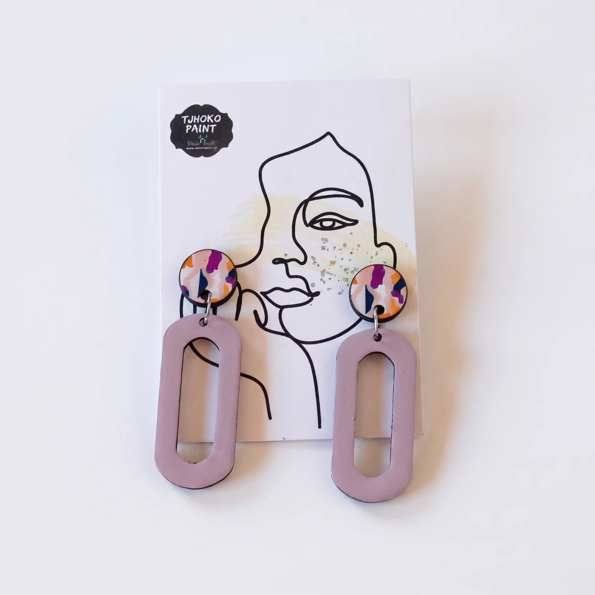 Pair of Tjhoko Earrings Range Precious Art earrings featuring colorful round tops and long lavender oval drops, displayed on