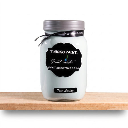 Tjhoko Paint Fine Lining 1L chalk paint in a clear glass jar with a black label, displayed on a wooden shelf.