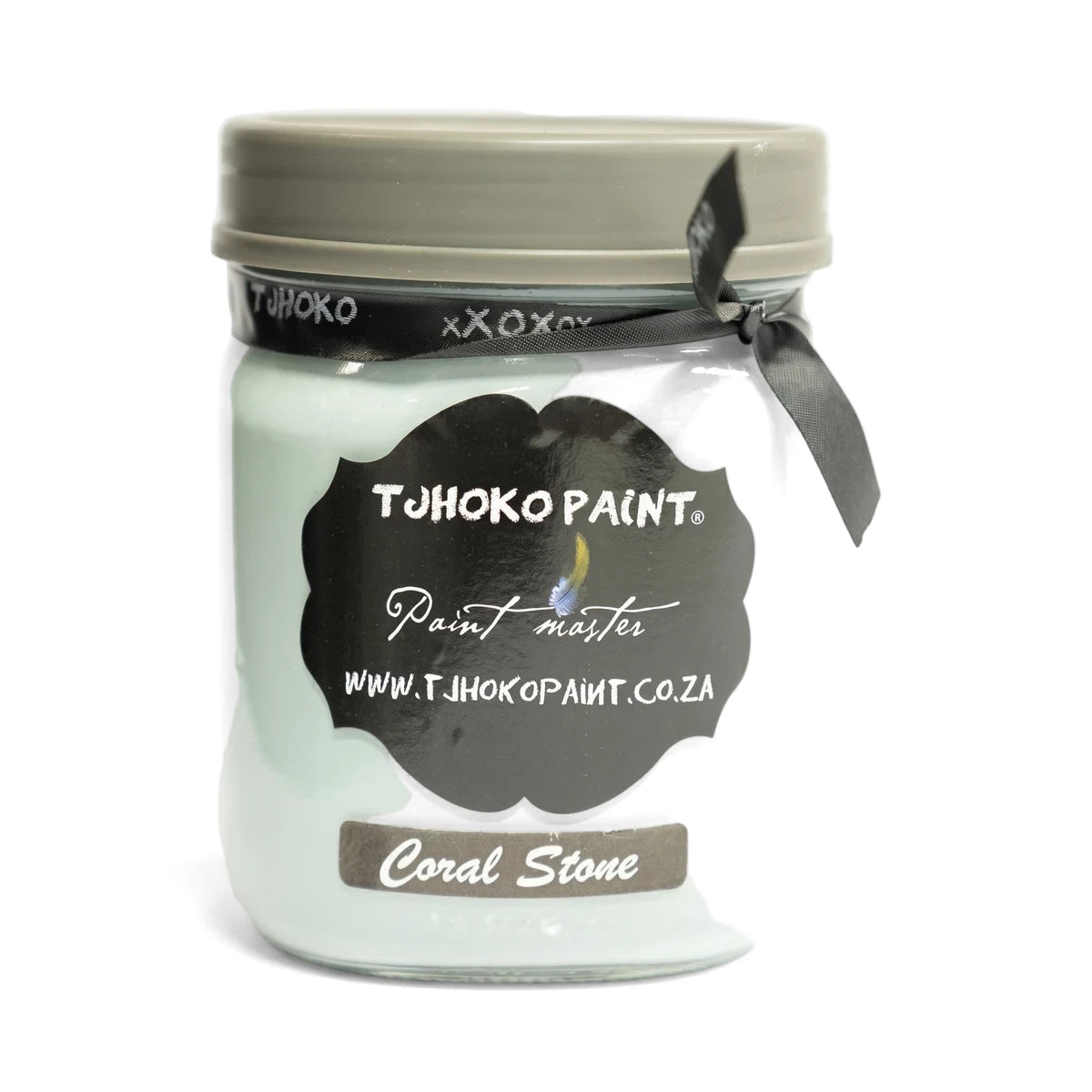 A 500ml glass jar of Tjohoko Paint in Coral Stone, a light teal color, with a gray lid and black ribbon.