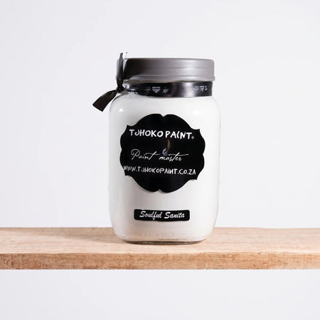 White Tohoko Paint jar in Soulful Sanita color, 1-liter size, featuring a black label and gray lid, displayed on a wooden