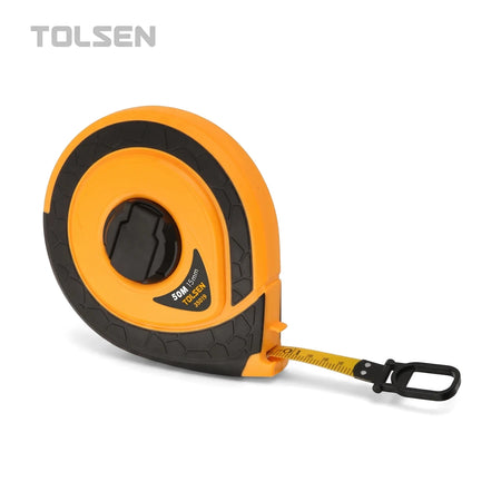An orange and black Tolsen Industrial Fiberglass Tape Measure, 30m by 15mm, with some yellow tape extended, shown from an