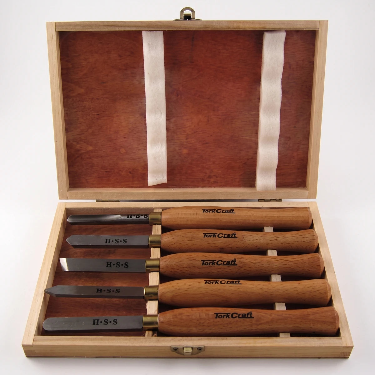 Five-piece Tork Craft bevel wood chisel set with H-S-S blades in an open wooden storage box, front view.