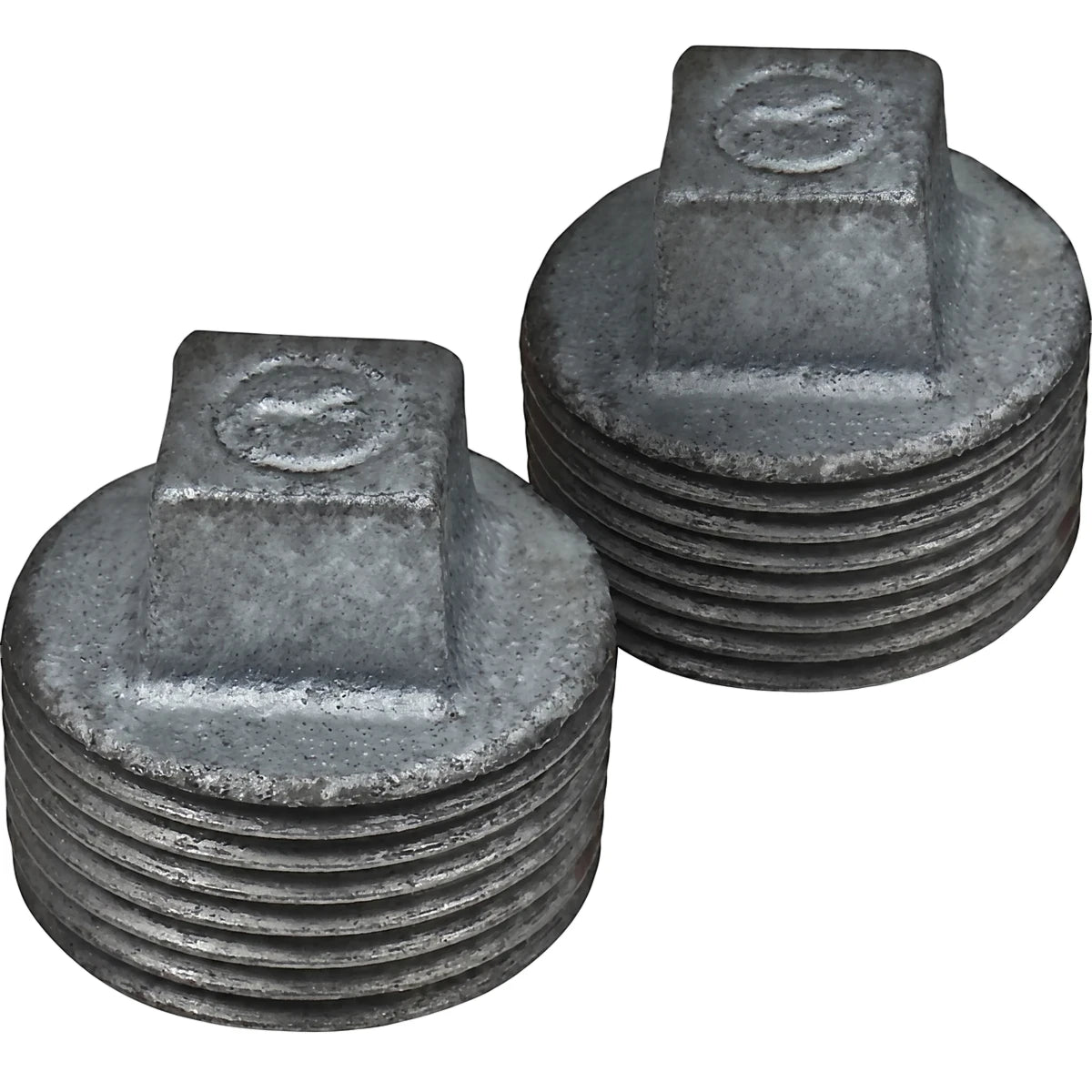 Two 3/4 inch galvanized plugs, made of durable metal with threaded sides and a square head, displayed in a pair.