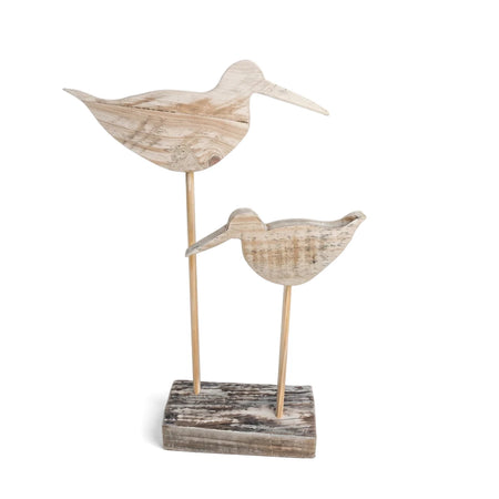 Two distressed wooden oyster catcher bird sculptures on a rectangular wooden stand, perfect for coastal decor.