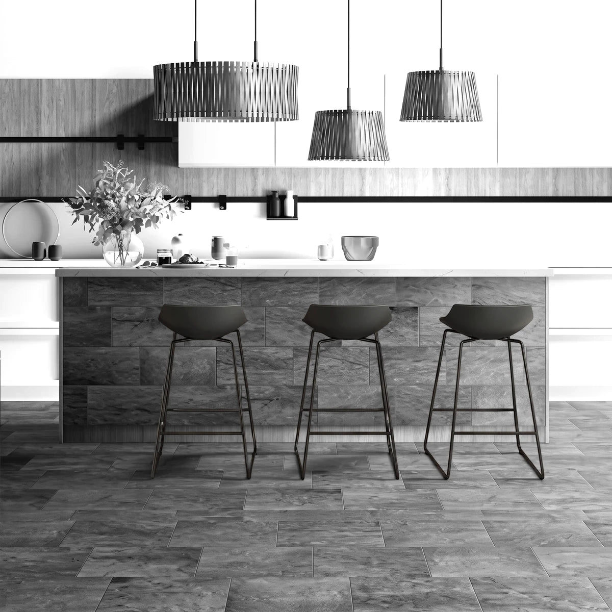 Modern kitchen island clad in Tzaneen Brown 25x49cm tiles, featuring a white countertop and three black bar stools.