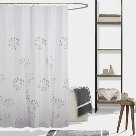 White shower curtain with gray dandelion pattern hanging in a bathroom with a wooden shelf and stool.