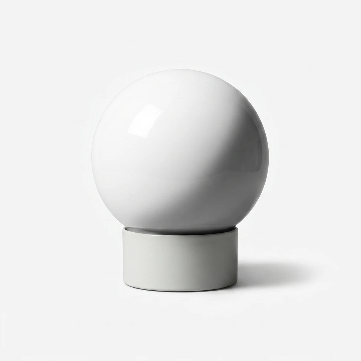 White spherical light fixture with a frosted glass sphere and a cylindrical base, shown against a plain white background.