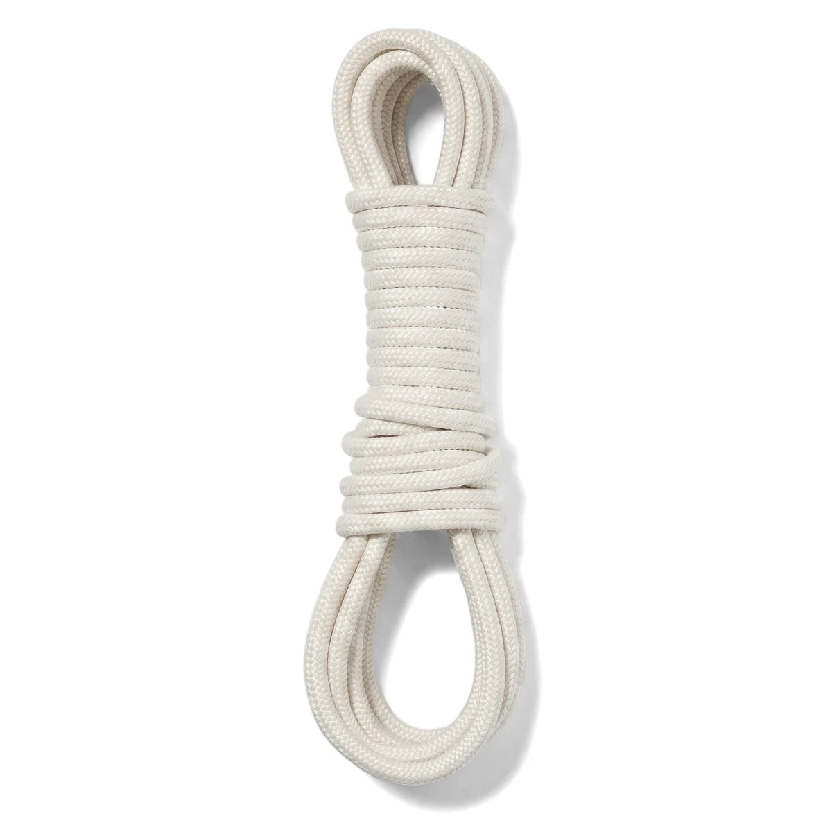 A white steel clothes line, coiled neatly into a figure-eight shape for storage or display against a plain background, ready