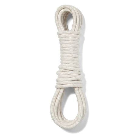 A white steel clothes line, coiled neatly into a figure-eight shape for storage or display against a plain background, ready
