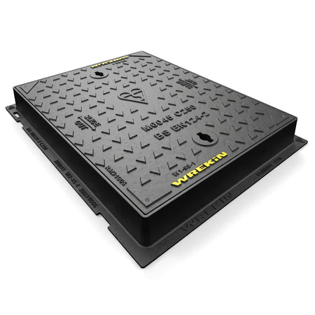 A heavy-duty dark grey Wrekin manhole cover, model MG045 C250, with a diamond plate surface and yellow branding.