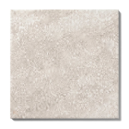 Close-up of a Zorah Bone 40X40Cm Tile, showcasing its textured light beige surface and square shape, ideal for contemporary